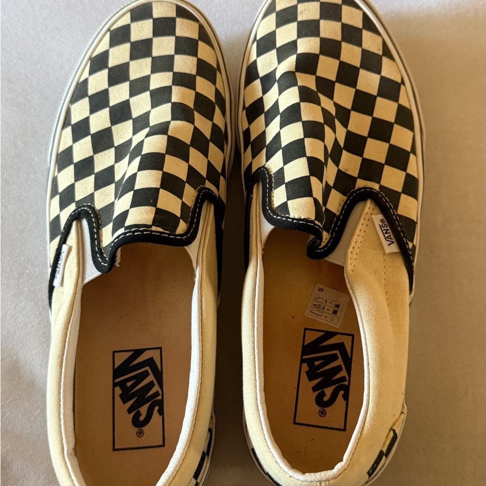 Vans womens Black and Cream Checkered Slip-On Sneakers